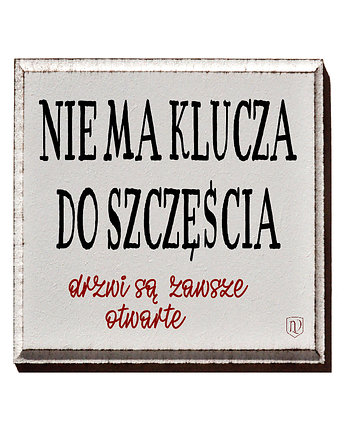 Tabliczka z napisem o szczęściu